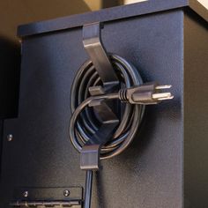 a close up of an electronic device with a cable plugged into the back of it