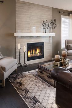 an artistic crystal sphere table lamp in a living room with two couches and a fireplace