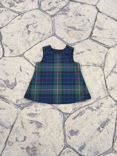 Beautiful handmade in Ayrshire Scotland Tartan Pinafore  Baby girls pinafore dress with button fastening at each shoulder, made in the Gunn Tartan. Fabric is polyester/viscose and the black lining is polyester/cotton  Available in sizes 0-6 months approximate length 14.5 inches 6-12 Months approximate length 16.5 inches 1-2 years approximate length 18 inches 2-3 years approximate length 20.5 inches 3-4years approximate length 21.5 inches I try to keep my stock regularly topped up but should an i Gunn Tartan, Robertson Tartan, Ayrshire Scotland, Scotland Tartan, Macleod Tartan, Girls Pinafore Dress, Girls Pinafore, Baby Girls Dresses, Black Watch Tartan