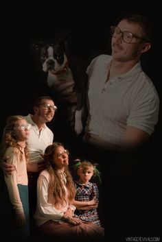 a man and two children with a dog in front of them on a black background