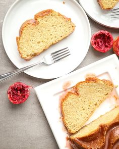 two plates with slices of bread and jam on them, one is cut in half