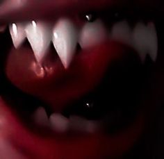 the mouth of a monster with sharp teeth