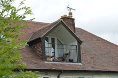 an open window on the side of a house