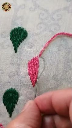 someone is stitching together some small christmas trees