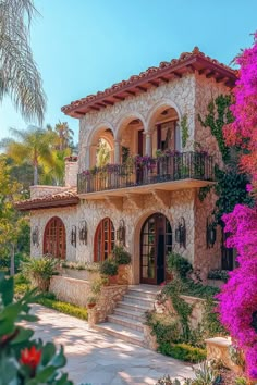 a large house with many windows and balconies