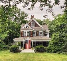 a large house with an american flag on the front