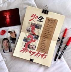 an open notebook with photos and writing on it