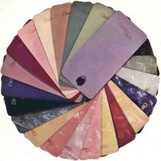 an assortment of different colored papers in a circle