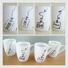 four coffee mugs with hand drawn designs on them, all in different shapes and sizes