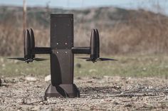 a remote controlled airplane sitting on top of a field