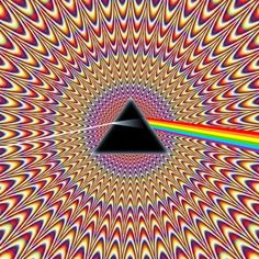 an image of the dark side of the moon with a rainbow light in it's center