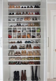 a white closet filled with lots of shoes