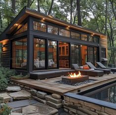 a house with a fire pit in the middle of it