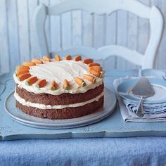 a cake sitting on top of a blue table