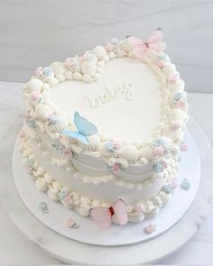 a heart shaped cake sitting on top of a white plate