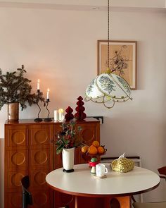 a dining room with a table and chairs