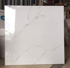 a large white marble slab in a warehouse