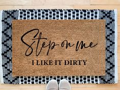 someone is standing in front of a door mat that says, stop on me i like it dirty