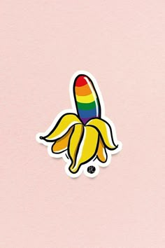 a sticker with a rainbow colored banana on it's side, against a pink background