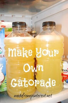 two bottles of cat food sitting on top of an open refrigerator door with the words make your own gatorade