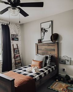 a bed room with a neatly made bed and a black and white checkered comforter