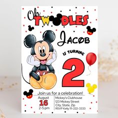 a mickey mouse birthday party with balloons and confetti