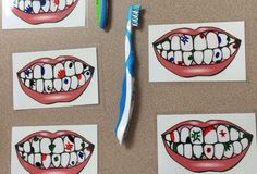 four different pictures of teeth and a toothbrush on a table with magnets attached to them