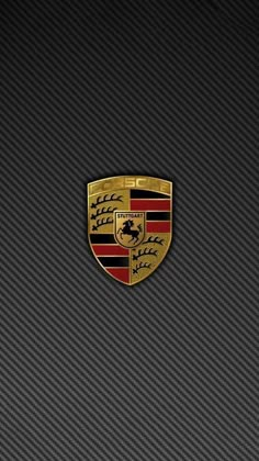 an image of a car emblem on the side of a black and red wallpaper