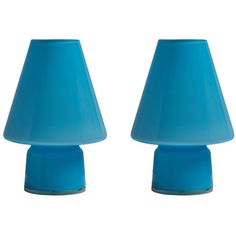 two blue lamps sitting next to each other