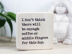 a wooden block with the words i don't think there will be enough coffee or middle fingers for this day