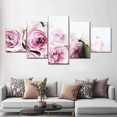 a living room scene with pink flowers on the wall