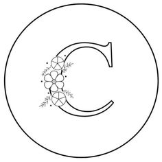 the letter c with flowers and leaves on it is outlined in black and white coloring