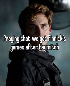 a man with the words praying that we get finnick's games after haymitch