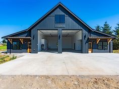 an open garage with two doors on the front