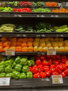 an assortment of vegetables on display in a grocery store