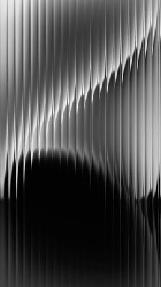 an abstract black and white photo with wavy lines