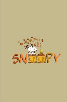 snoopy is sitting in the barrel with autumn leaves coming out of his head and on top