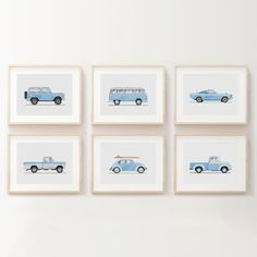 four blue cars are mounted on the wall