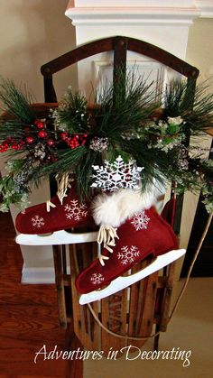 christmas stockings and snowflakes are sitting on a sled