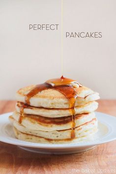 pancakes on a plate with syrup being drizzled over them and the words perfect pancakes