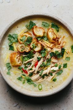 a bowl filled with soup and garnished with parsley