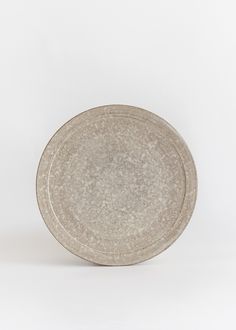 a white plate sitting on top of a table