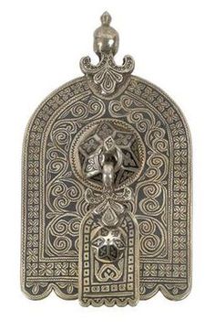 Silver Moroccan house symbol in Hand of Fatima (Hamza) form. A house symbol that is hung in the house as a protective amulet. A small Hand of Fatima with a similar pattern hangs on a central knob. Moroccan House, House Symbol, Protective Amulet, Boulder Colorado, Silver Engraving, Bead Shop, Hand Art