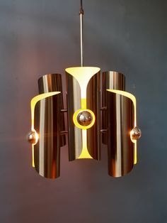 a modern chandelier hanging from a ceiling