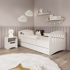 a child's bedroom with a pink bed and white rugs on the floor