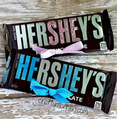 two hershey's candy bars with bows on them