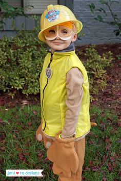 a little boy dressed up as a fireman