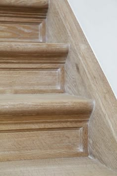 close up view of wooden stairs with handrails