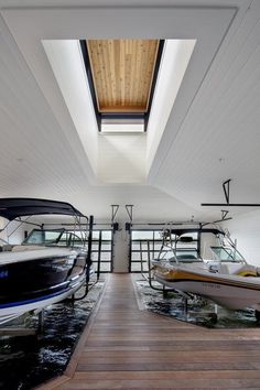 the inside of a boat dock with several boats