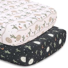 two mattresses with cactus designs on them, one in black and the other in pink